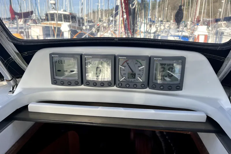 Slide: The Image of Cockpit instruments on a 2005 C&C 110 sailboat, displaying navigation data. - 39