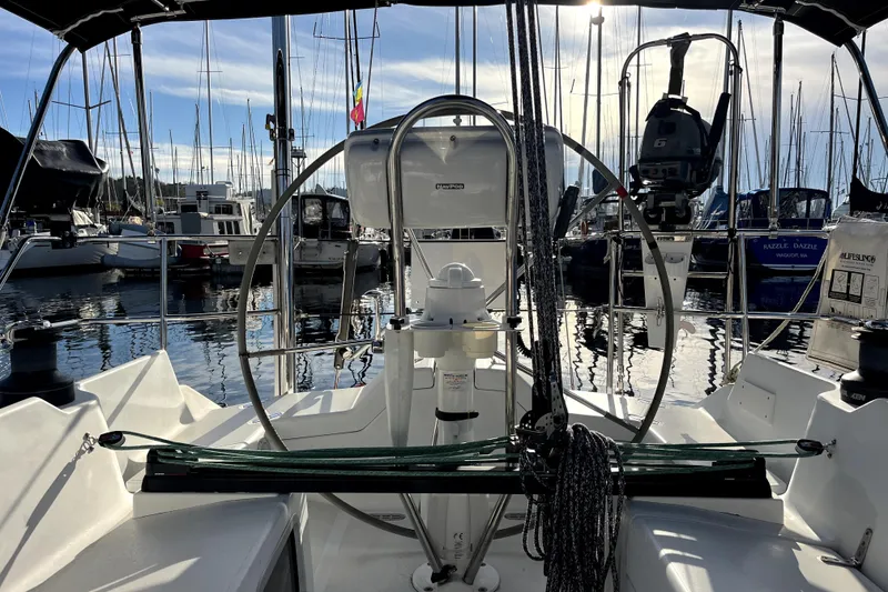 Slide: The Image of Cockpit view of a 2005 C&C 110 sailboat docked in a marina. - 42