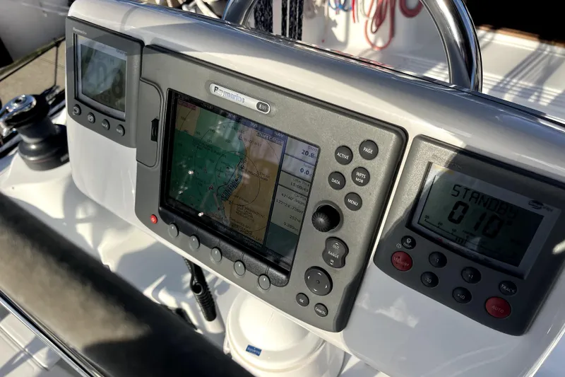 Slide: The Image of Cockpit navigation system on a 2005 C&C 110 sailboat, featuring Raymarine displays. - 44