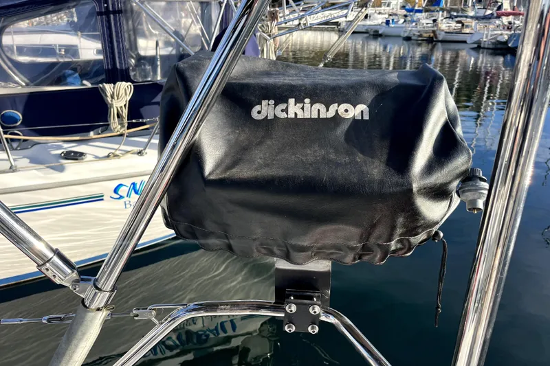 Slide: The Image of Boat with Dickinson grill cover, docked at marina, C&C 110 model, 2005. - 47
