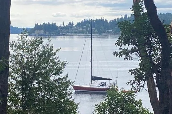 Slide: The Image of Sailboat on tranquil lake surrounded by trees, C&C 110 model, 2005. - 54