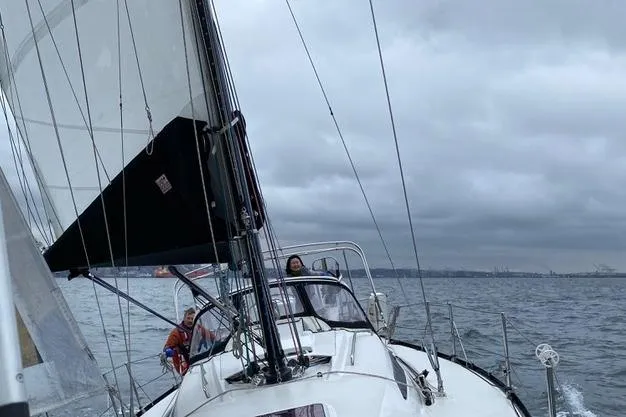 Slide: The Image of Sailing on a C&C 110 yacht, 2005 model, under cloudy skies. - 55