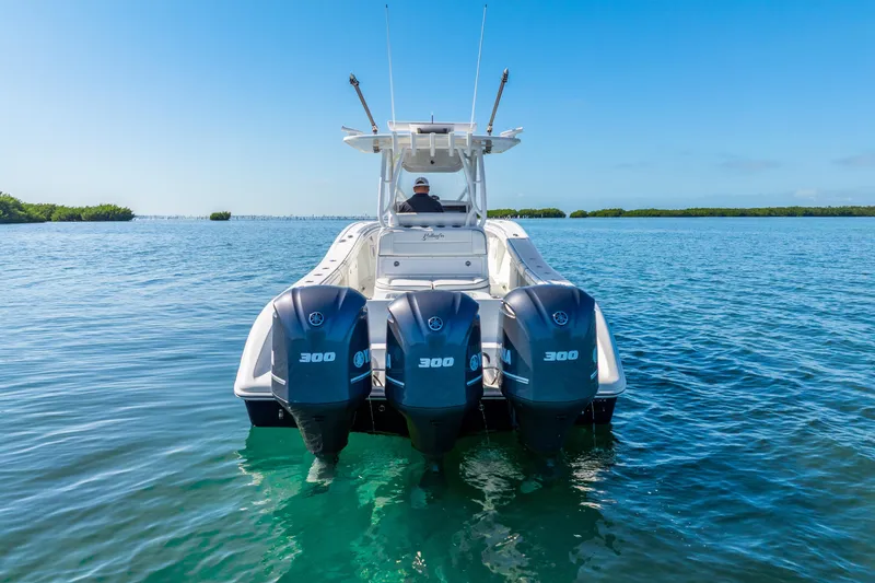 Slide: The Image of 2016 Yellowfin 36 Offshore boat with triple Yamaha 300 engines on clear water. - 11