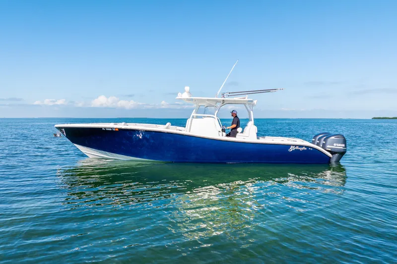 Slide: The Image of 2016 Yellowfin 36 Offshore boat on calm blue ocean waters. - 13