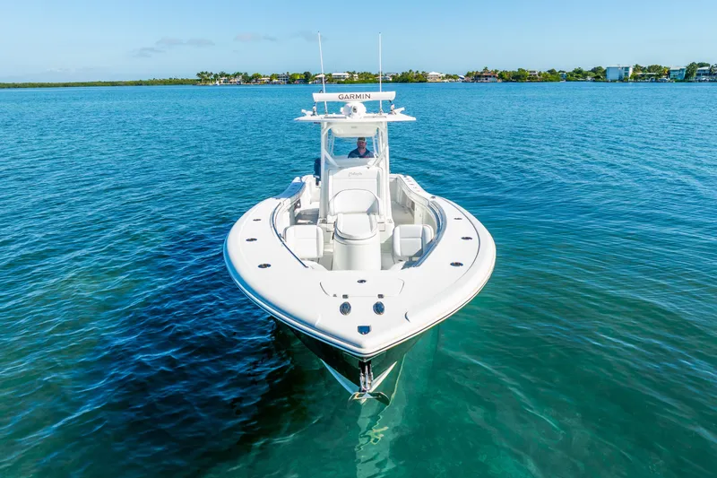 Slide: The Image of 2016 Yellowfin 36 Offshore boat on clear blue water, front view. - 15