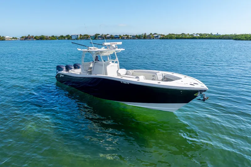 Slide: The Image of 2016 Yellowfin 36 Offshore boat on clear blue water, sunny day. - 16