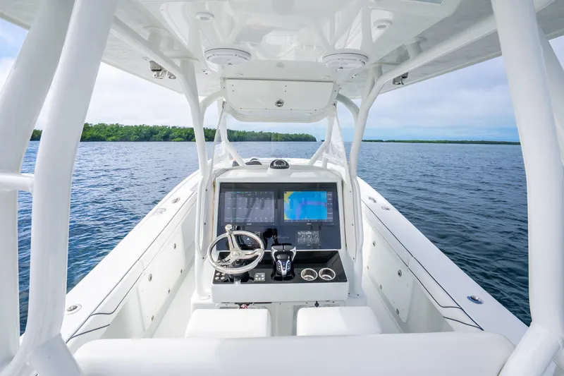 Slide: The Image of 2016 Yellowfin 36 Offshore boat cockpit with navigation system on open water. - 20