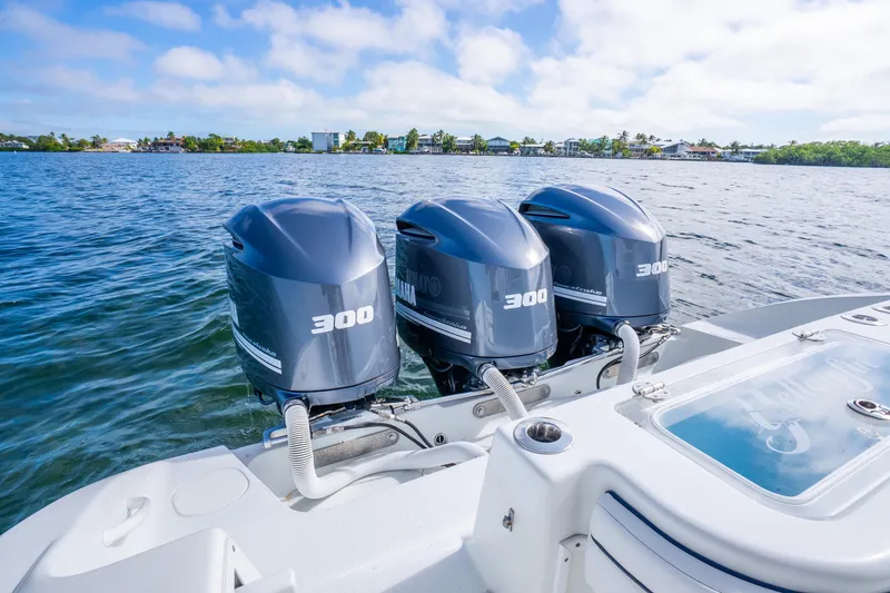 Slide: The Image of 2016 Yellowfin 36 Offshore boat with triple 300 horsepower engines on water. - 32