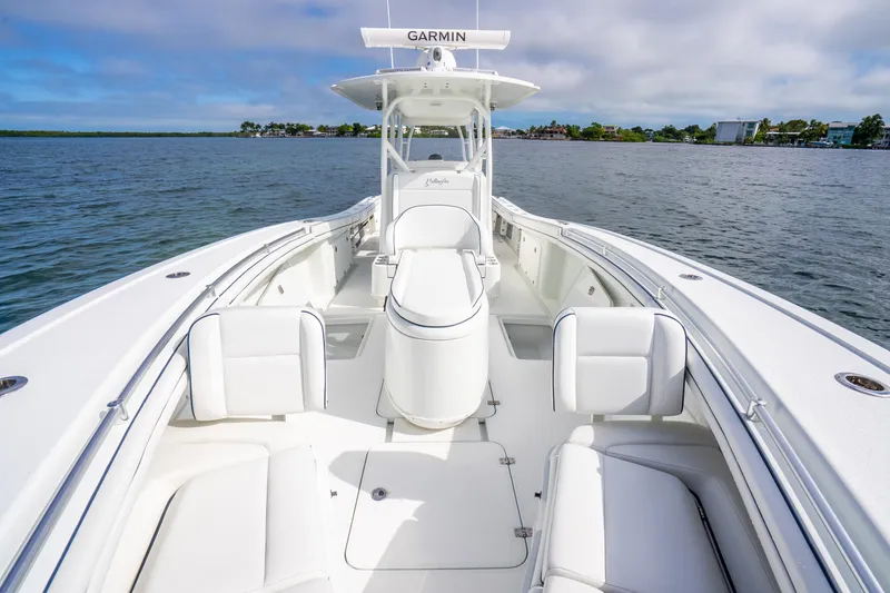 Slide: The Image of 2016 Yellowfin 36 Offshore boat with spacious deck and seating on calm water. - 37