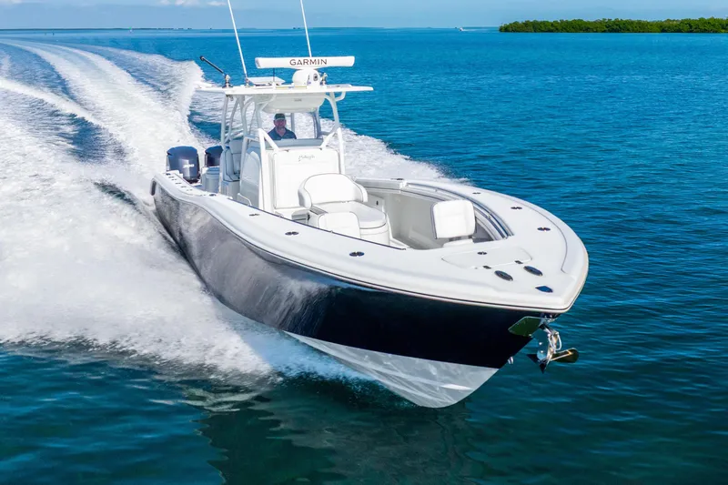 Slide: The Image of 2016 Yellowfin 36 Offshore boat cruising on clear blue water. - 4