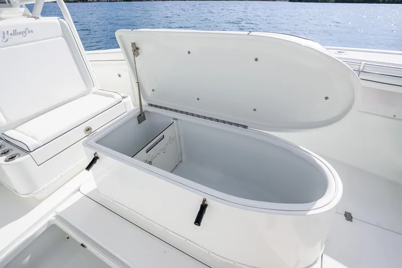 Slide: The Image of 2016 Yellowfin 36 Offshore boat with open storage compartment on deck. - 42