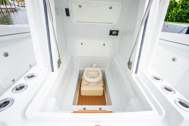 Slide: The Image of 2016 Yellowfin 36 Offshore boat interior with compact marine toilet. - 44