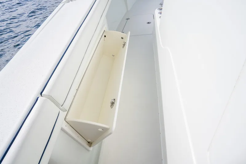 Slide: The Image of 2016 Yellowfin 36 Offshore boat with open storage compartment on deck. - 45