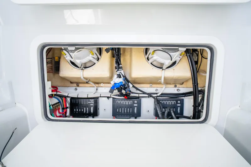 Slide: The Image of Electrical compartment of 2016 Yellowfin 36 Offshore boat, showcasing wiring and components. - 50