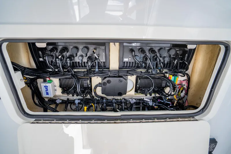 Slide: The Image of Electrical system inside a 2016 Yellowfin 36 Offshore boat, showcasing wiring and components. - 51
