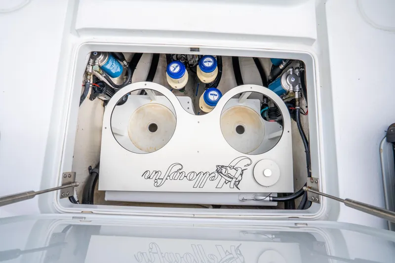 Slide: The Image of Engine compartment of 2016 Yellowfin 36 Offshore boat, showcasing mechanical components. - 54