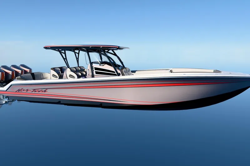 The Image of 2026 Nor-Tech 390 Sport Center Console boat on calm water, sleek design, multiple engines. - 1