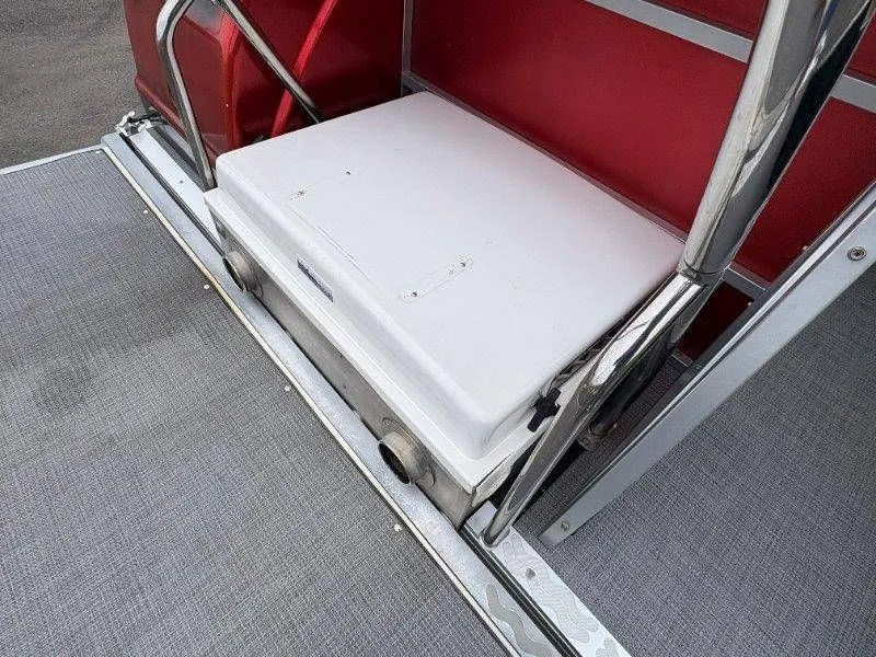 Slide: The Image of JC 246 IO 2008 boat seat with red background. - 23