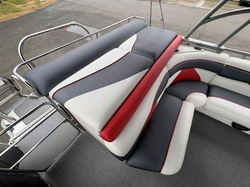 Slide: The Image of Upholstery of a 2008 JC 246 IO boat in red, gray, and white. - 25