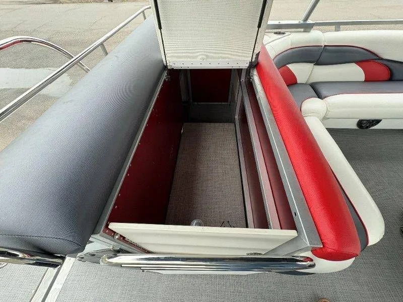 Slide: The Image of Open storage compartment on a 2008 JC 246 IO boat. - 27
