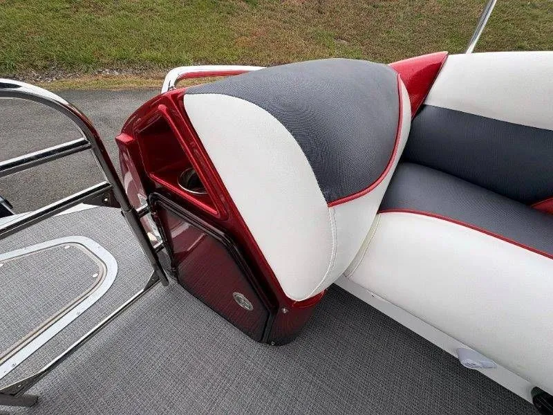 Slide: The Image of Interior of a 2008 JC 246 IO boat with red and gray seating. - 32