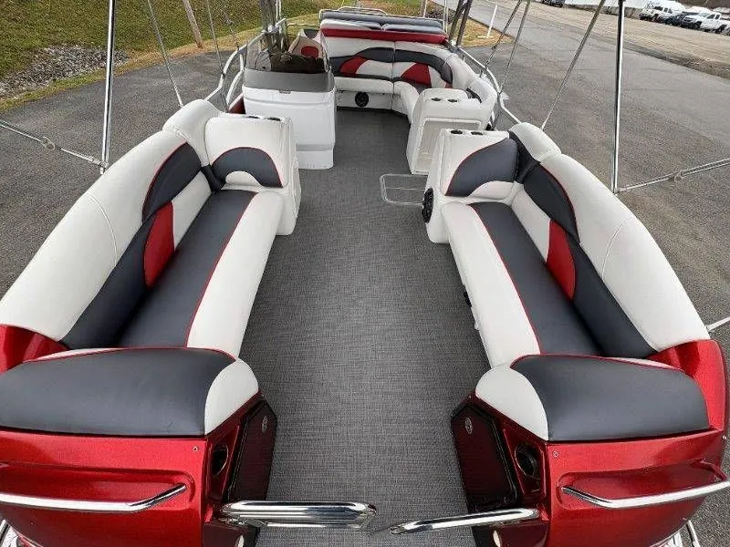 Slide: The Image of Interior of a 2008 JC 246 IO boat with red and gray seating. - 33