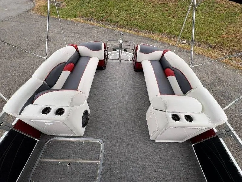 Slide: The Image of Interior of a 2008 JC 246 IO boat with cushioned seating. - 35
