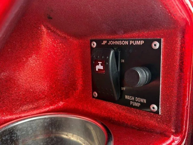 Slide: The Image of Johnson Pump switch in red casing, 2008 JC 246 IO. - 37