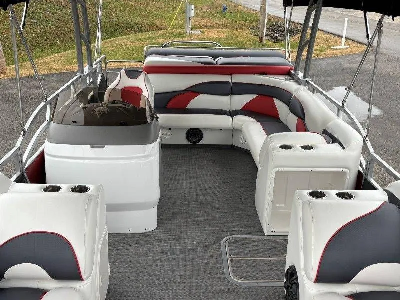 Slide: The Image of Interior of a 2008 JC 246 IO pontoon boat with gray and red seating. - 44
