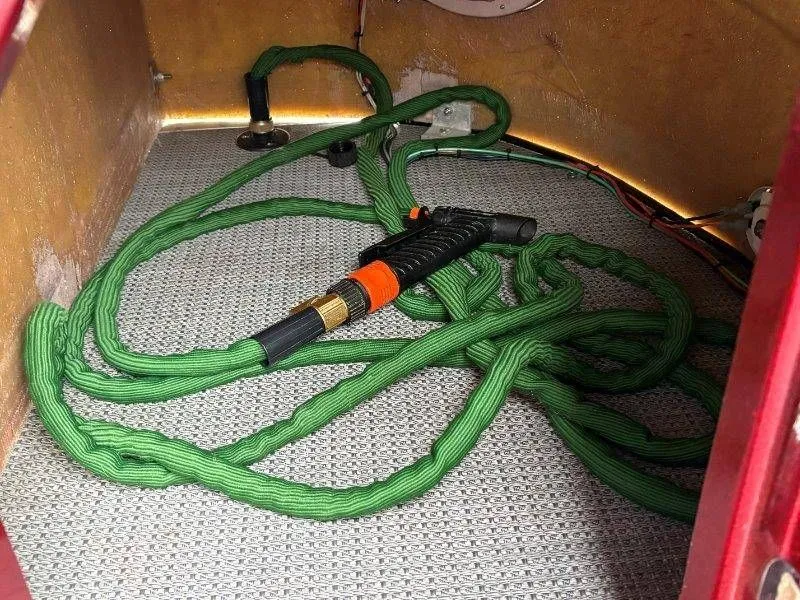 Slide: The Image of Green hose and spray gun in JC 246 IO boat, year 2008. - 45