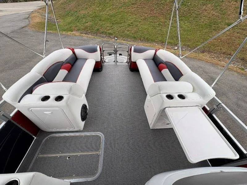 Slide: The Image of Interior of a 2008 JC 246 IO pontoon boat with gray and red seating. - 46