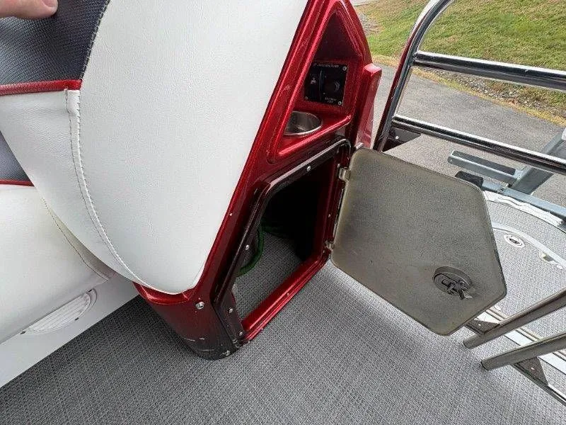 Slide: The Image of Open storage compartment on a 2008 JC 246 IO boat. - 48