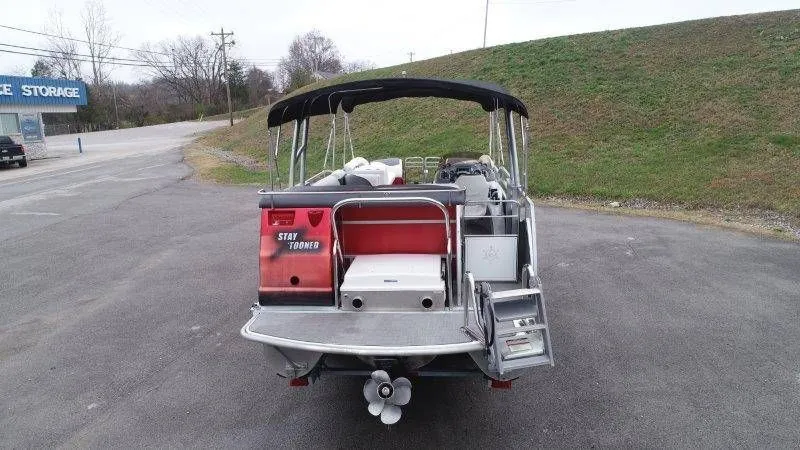 Slide: The Image of Rear view of a 2008 JC 246 IO pontoon boat on asphalt. - 8