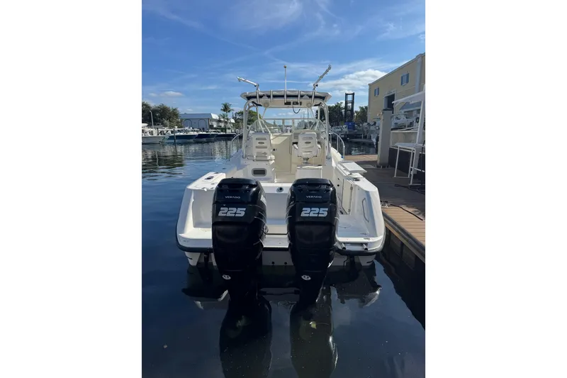 Slide: The Image of 2006 Boston Whaler 285 Conquest boat with dual 225 Verado engines docked. - 2