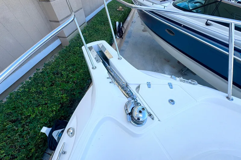 Slide: The Image of 2006 Boston Whaler 285 Conquest boat deck with anchor and railing. - 35