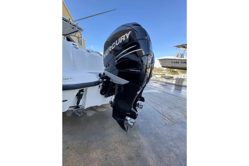 Slide: The Image of 2006 Boston Whaler 285 Conquest with Mercury Verado outboard engine, docked on a sunny day. - 4