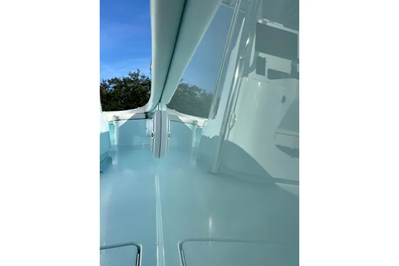 Slide: The Image of 2024 Contender 24 Sport boat interior with sleek design and glossy finish. - 12