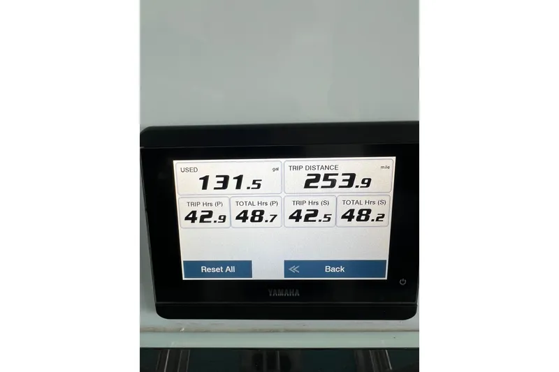 Slide: The Image of Yamaha display showing fuel usage and trip data for 2024 Contender 24 Sport boat. - 13