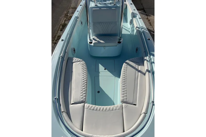 Slide: The Image of 2024 Contender 24 Sport boat interior with cushioned seating and sleek design. - 2