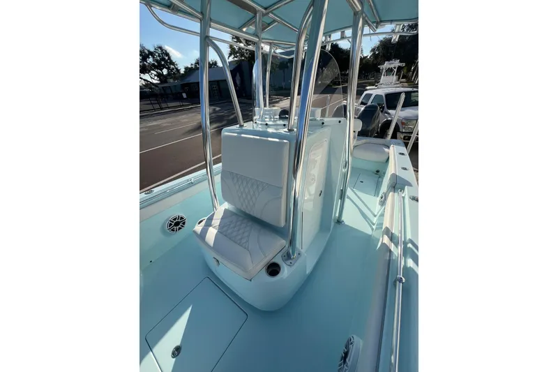 Slide: The Image of 2024 Contender 24 Sport boat interior with seating and console, featuring sleek design elements. - 5