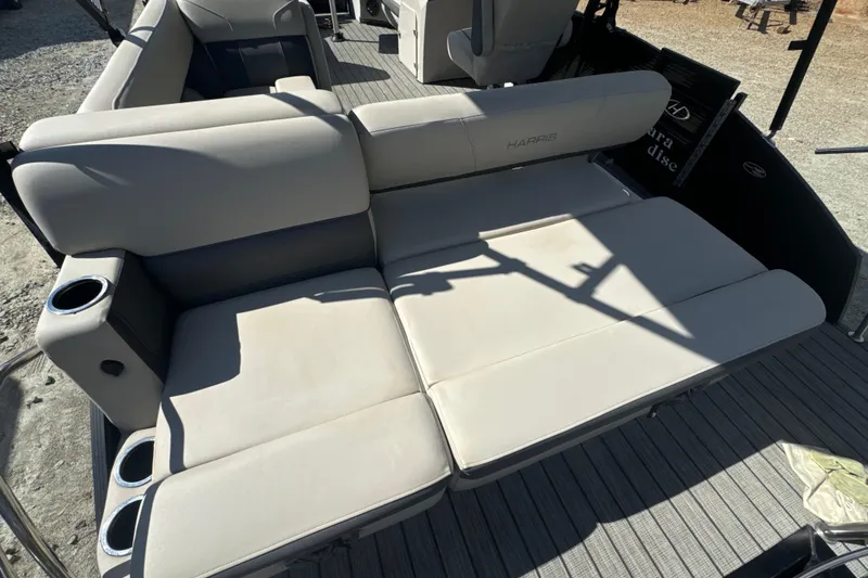 Slide: The Image of 2023 Harris HCX 230 Swingback boat interior with plush seating and cup holders. - 8