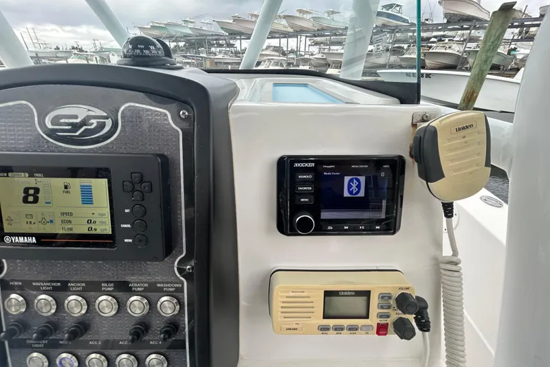 Slide: The Image of 2016 Sea Fox 246 Commander dashboard with Yamaha controls and Uniden radio. - 12