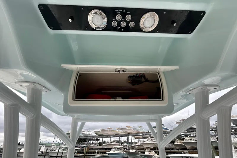 Slide: The Image of 2016 Sea Fox 246 Commander boat console with open storage compartment and control panel. - 18