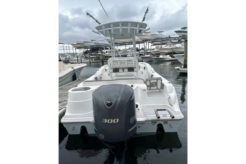 Slide: The Image of 2016 Sea Fox 246 Commander boat docked, featuring a powerful 300 HP engine. - 4