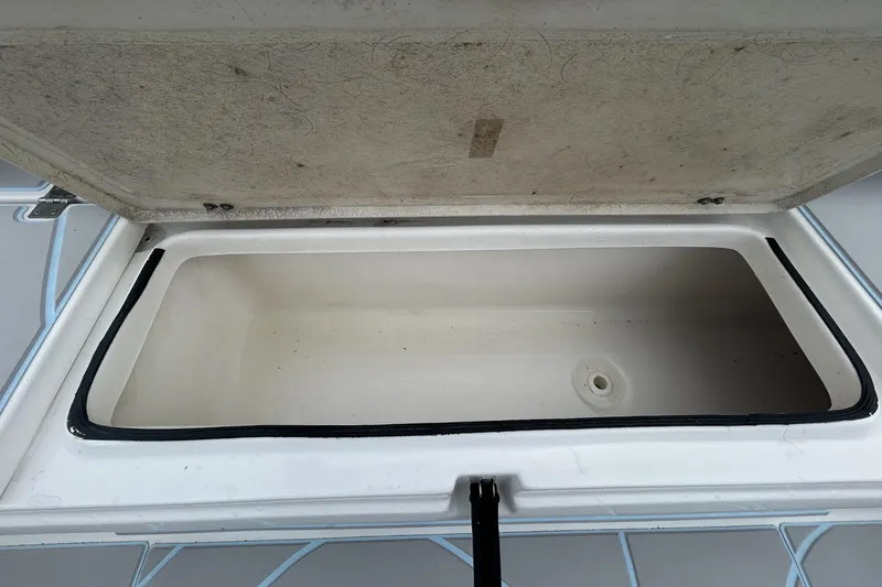Slide: The Image of Open storage compartment on a 2016 Sea Fox 246 Commander boat. - 6