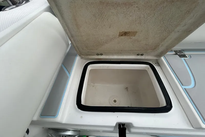 Slide: The Image of Open storage compartment on a 2016 Sea Fox 246 Commander boat. - 7