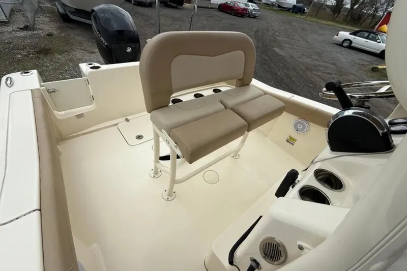 Slide: The Image of 2023 Scout 215 XSF boat interior with seating and control panel. - 9