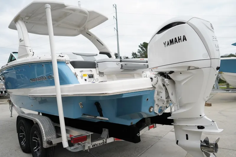 Slide: The Image of 2026 Chaparral 270 OSX boat with Yamaha engine on trailer. - 1