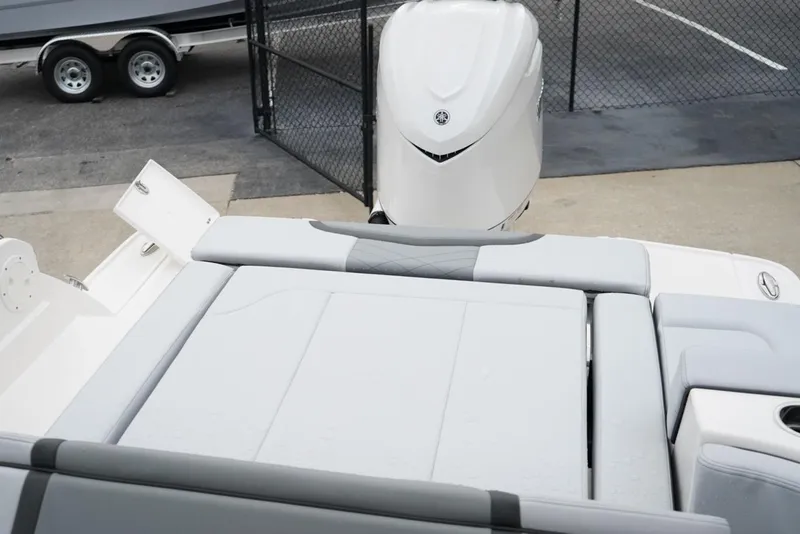 Slide: The Image of 2026 Chaparral 270 OSX boat with sleek seating and powerful outboard motor. - 13