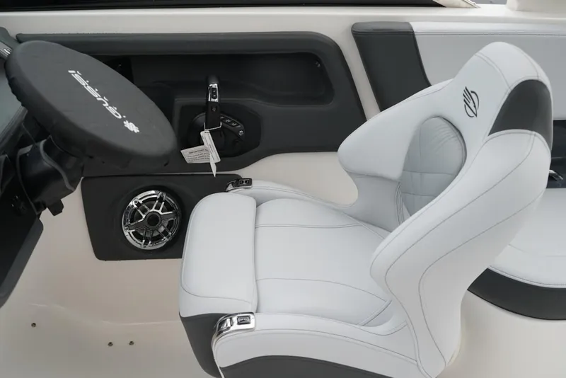 Slide: The Image of Luxury cockpit of 2026 Chaparral 270 OSX boat with sleek white seating. - 14